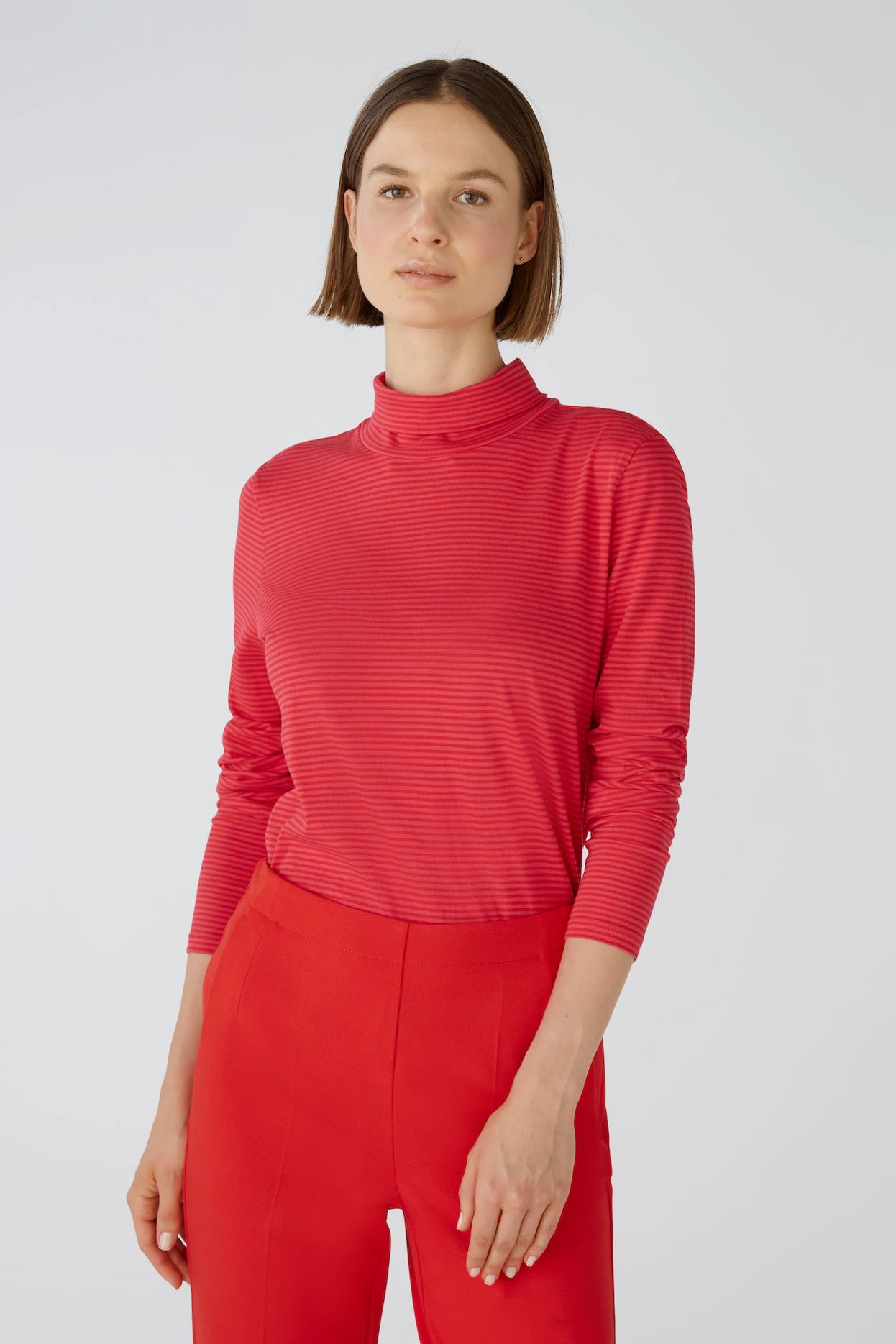 590923 Chandail col roulée rayé rouge et rose